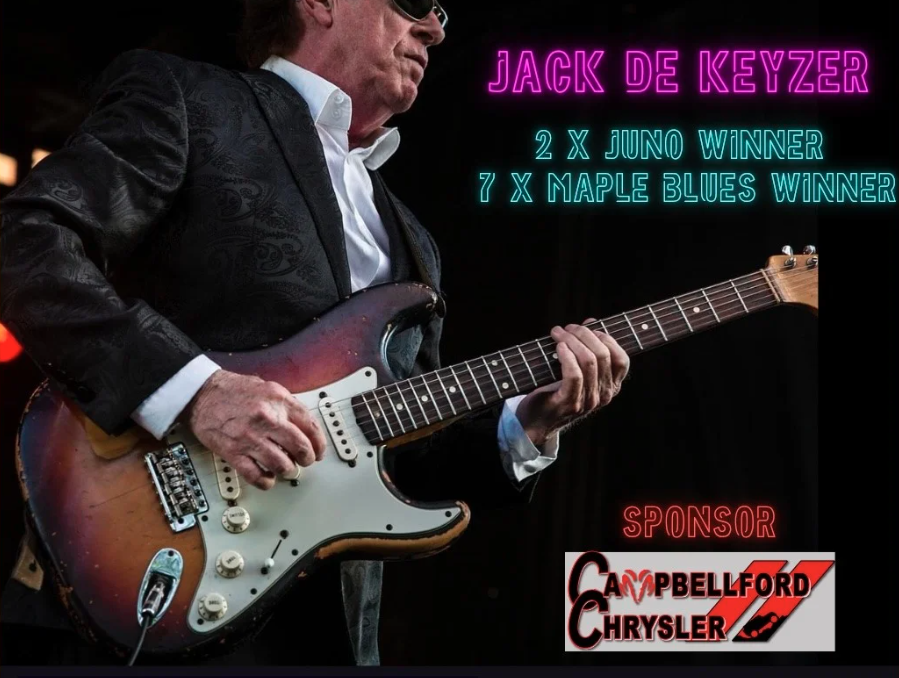 Jack De Keyzer. Image of him playing a guitar.