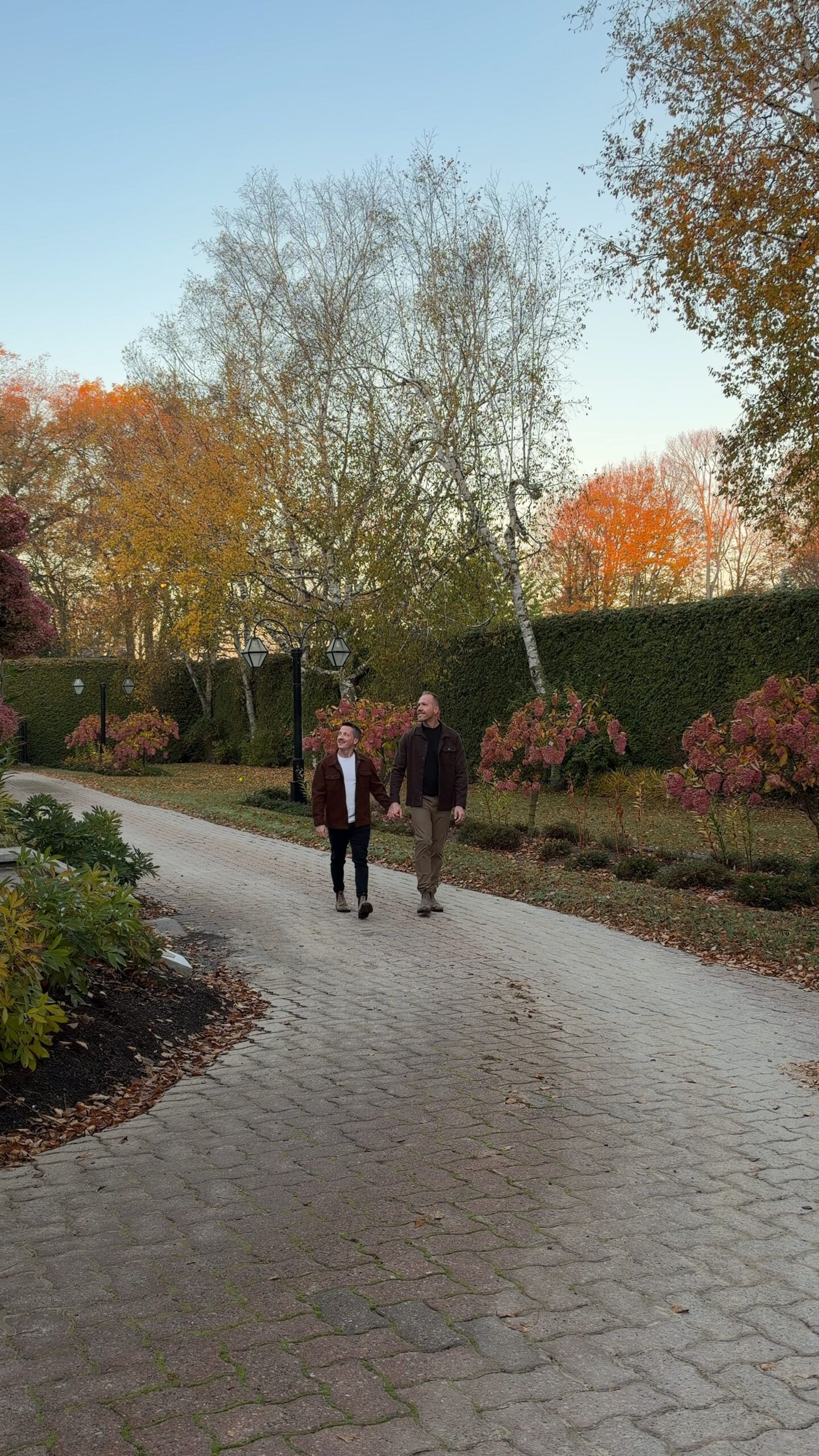 2 men walking the property of a bed and breakfast